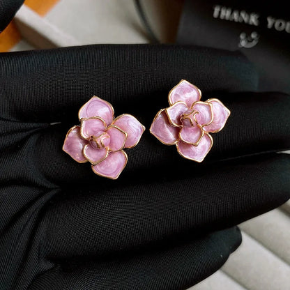 Gold plated purple floral stud earrings with oil-spot glaze on copper