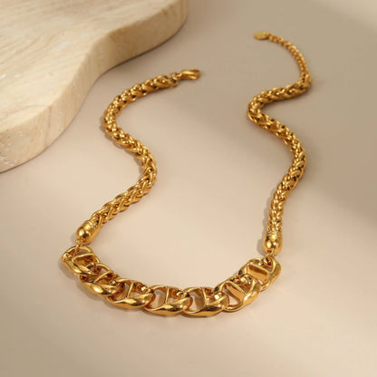 Gold plated stainless steel necklace with geometric pendant for women, shown in two colour options.