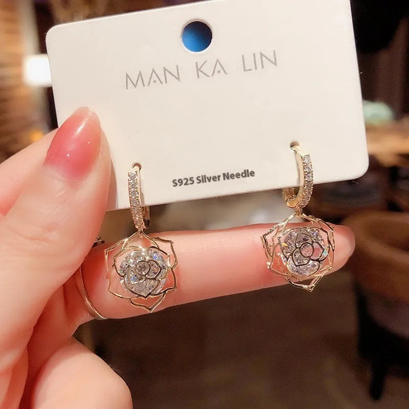 Geometric copper women's earrings with zircon accents and rose design elements in multiple colour variations