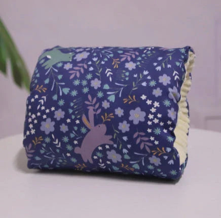 Adjustable nursing pillow with various color options, designed to provide comfort and support for breastfeeding mothers