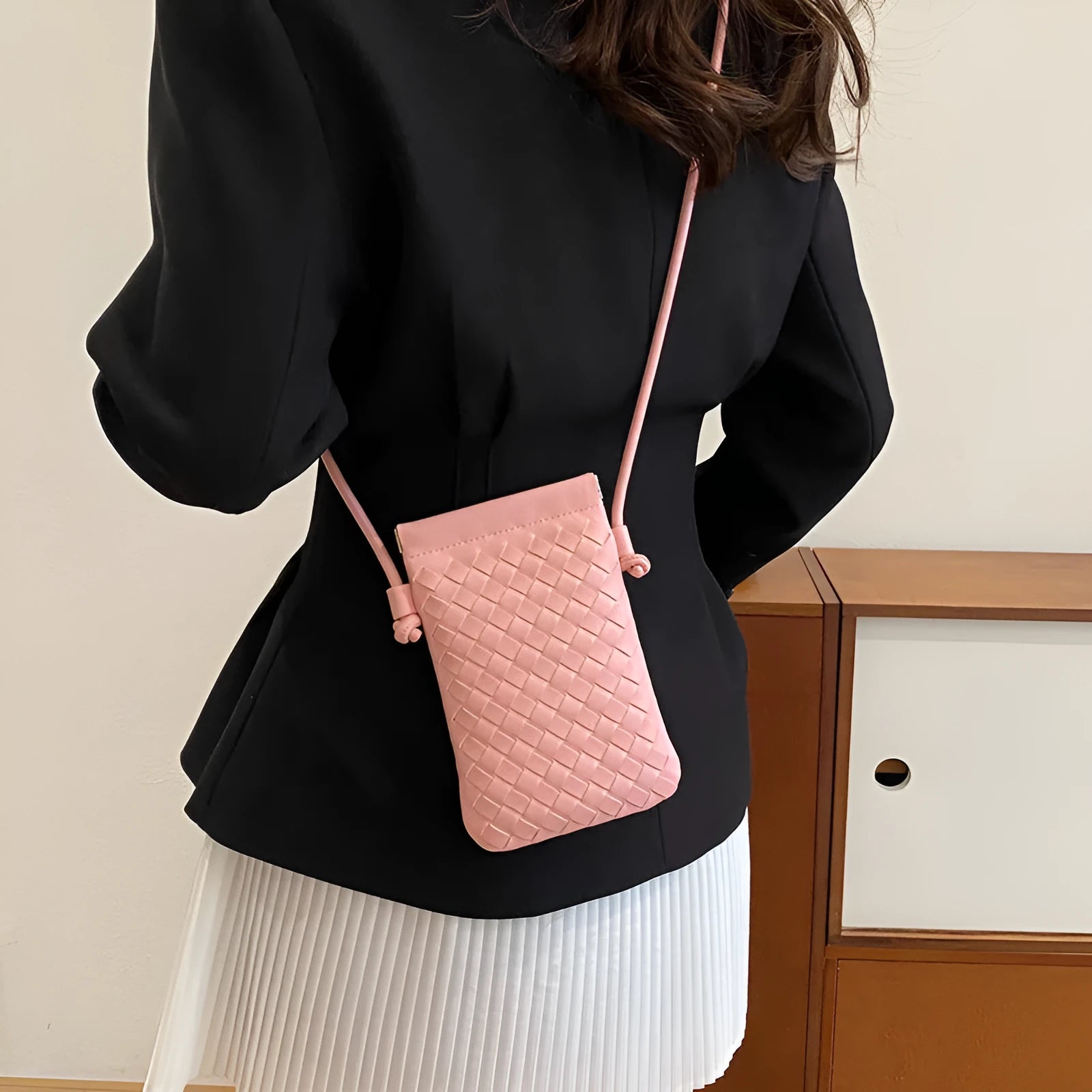 Vintage weave crossbody phone bag in pu leather showing vertical square design and dark cell interior