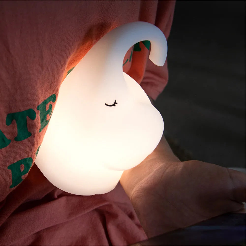 White elephant-shaped night light with silicone texture, 96mm wide by 151mm tall, emitting warm white glow