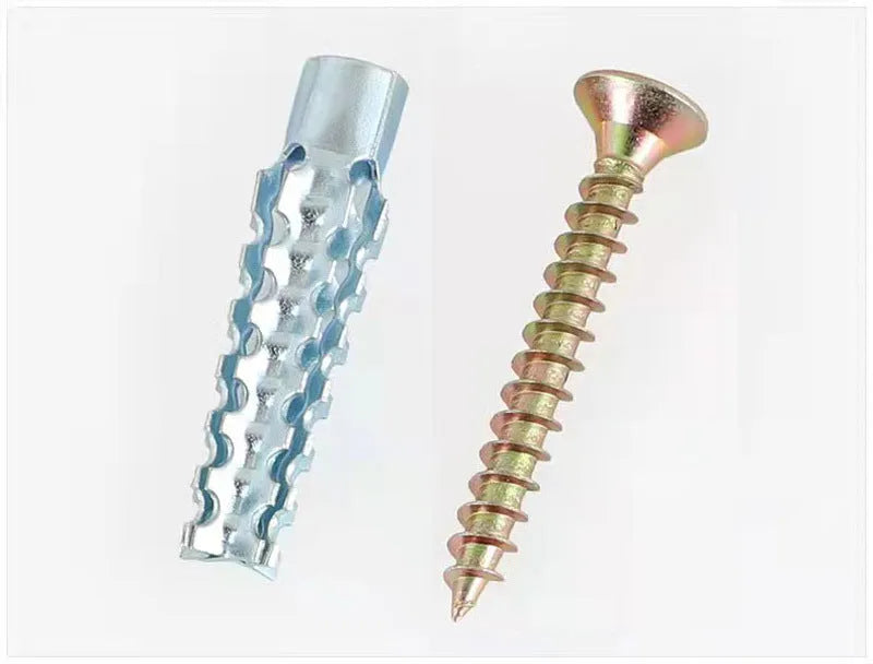 Barbed serrated metal expansion screw anchor for brick and concrete walls in various sizes.