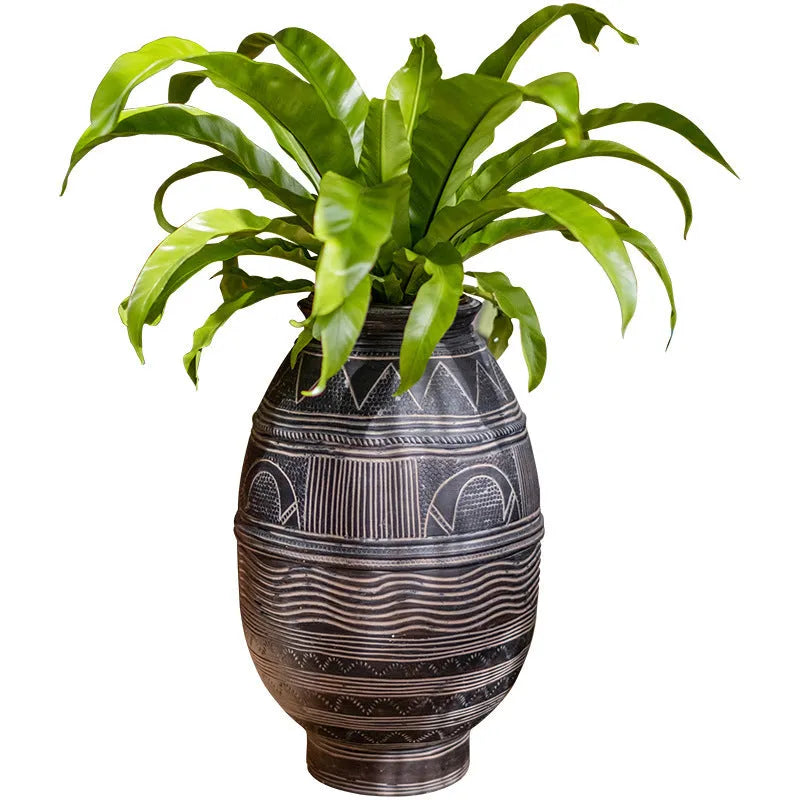 Medium cement African Ancient Tank style flower pot with a textured finish and drainage hole.