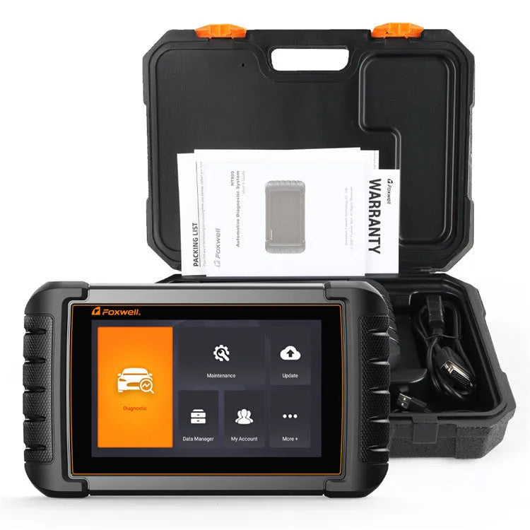 NT809 automotive diagnostic scanner with main unit, cables, and OBDII adapter on workshop bench