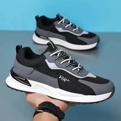 Men's colour block mesh sneakers in black, grey, and white with lace-up front and low-top design