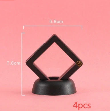 3D floating jewelry coin display stand in white and black, showcasing collectibles in mid-air