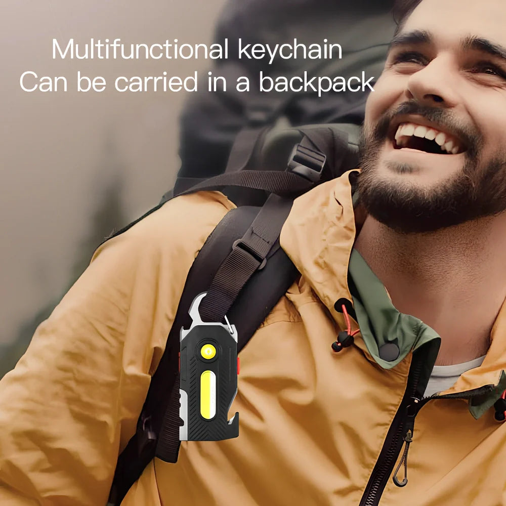 Multifunctional emergency light with mountaineering buckle showing bottle opener and seat belt cutter tools
