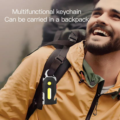 Multifunctional emergency light with mountaineering buckle showing bottle opener and seat belt cutter tools