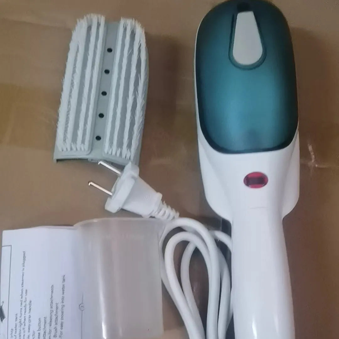 Handheld portable garment steamer with mechanical controls and dual voltage compatibility