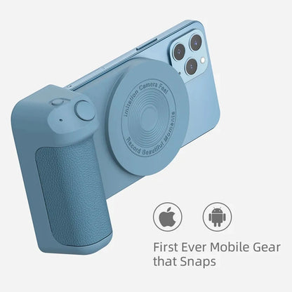 Black magnetic phone camera grip with rotatable bracket and ergonomic PU leather handle on a table.