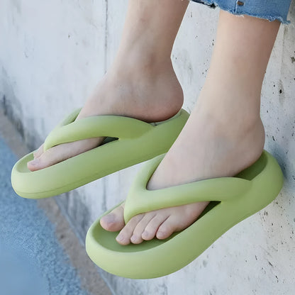 Solid colour thick-soled flip-flops with a bow on the strap, shown in multiple colour options.