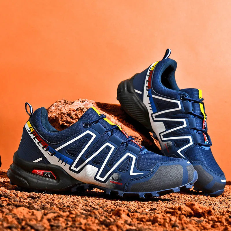 Men's low-top casual shoe in grey orange with synthetic leather upper and mesh lining.