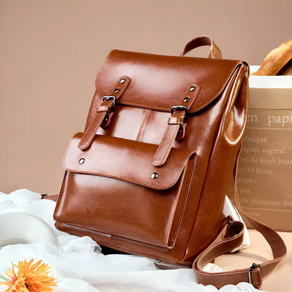 Genuine cowhide leather women's computer backpack in black, shown from a front perspective.