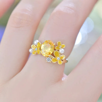 Women's adjustable open ring with flower and pearl design in yellow or light purple electroplated metal