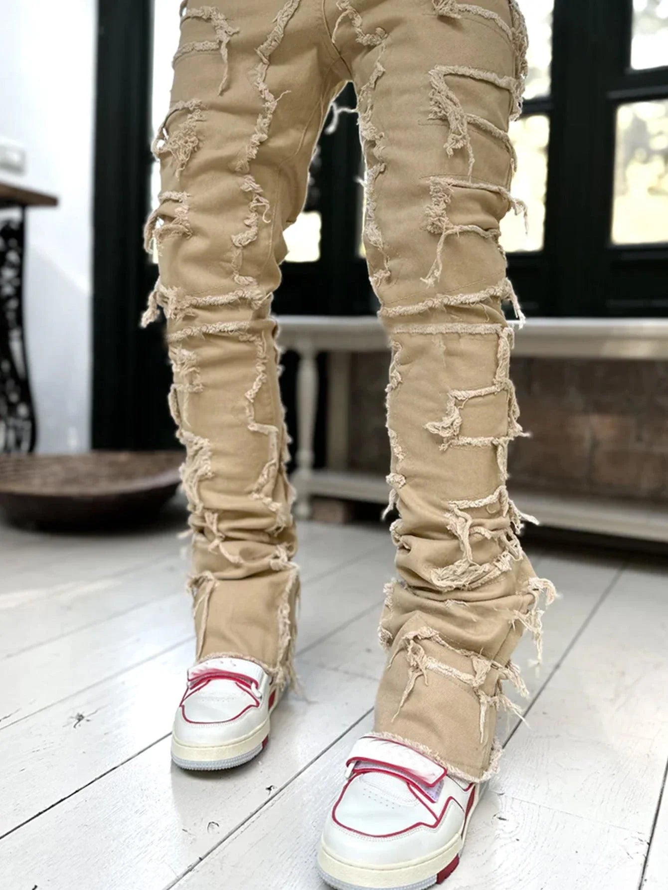 Men's slim-fit cotton jeans with unique patched design in various classic colors