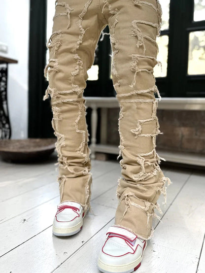 Men's slim-fit cotton jeans with unique patched design in various classic colors