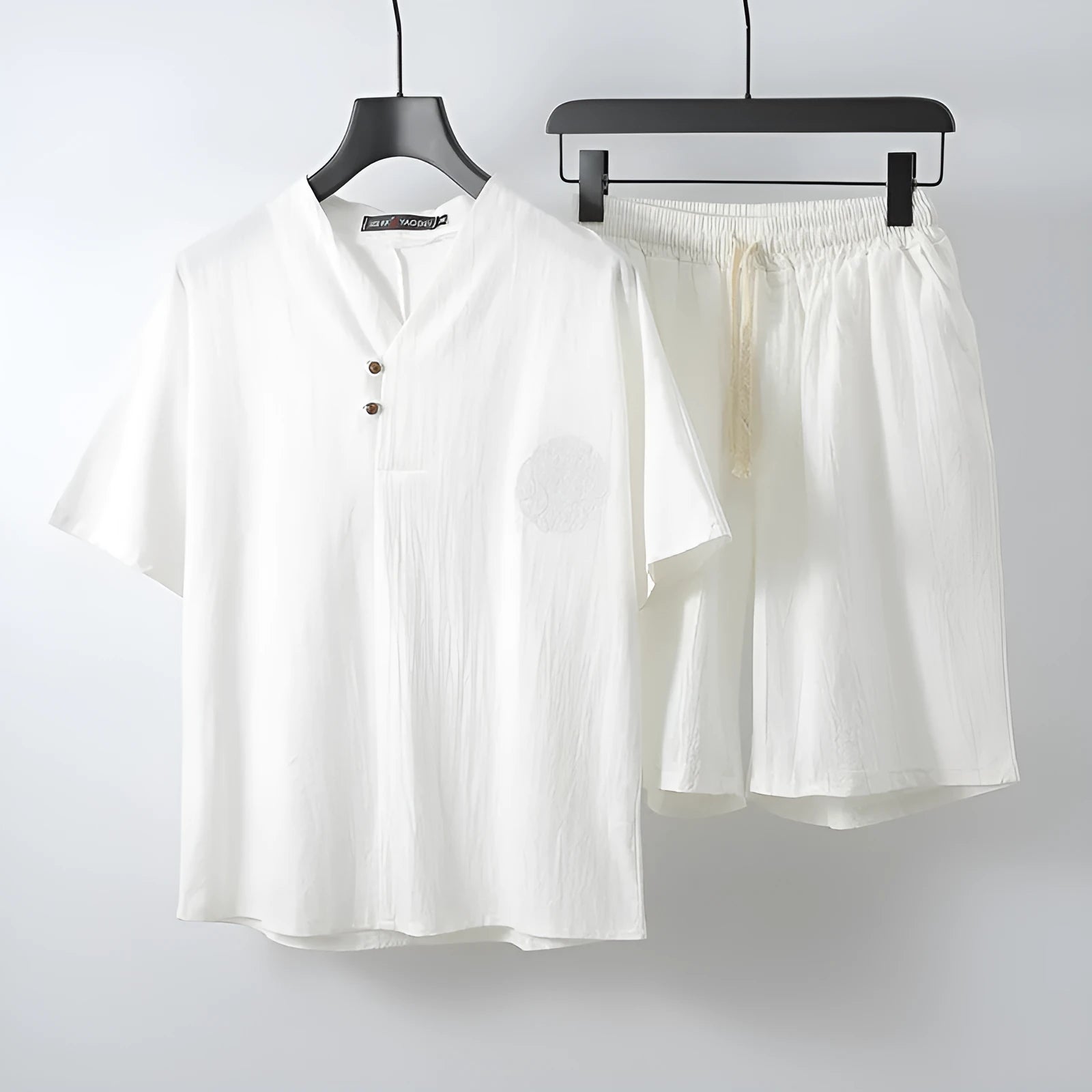 Loose linen-style men's two-piece set with short sleeve top and shorts in cotton fabric