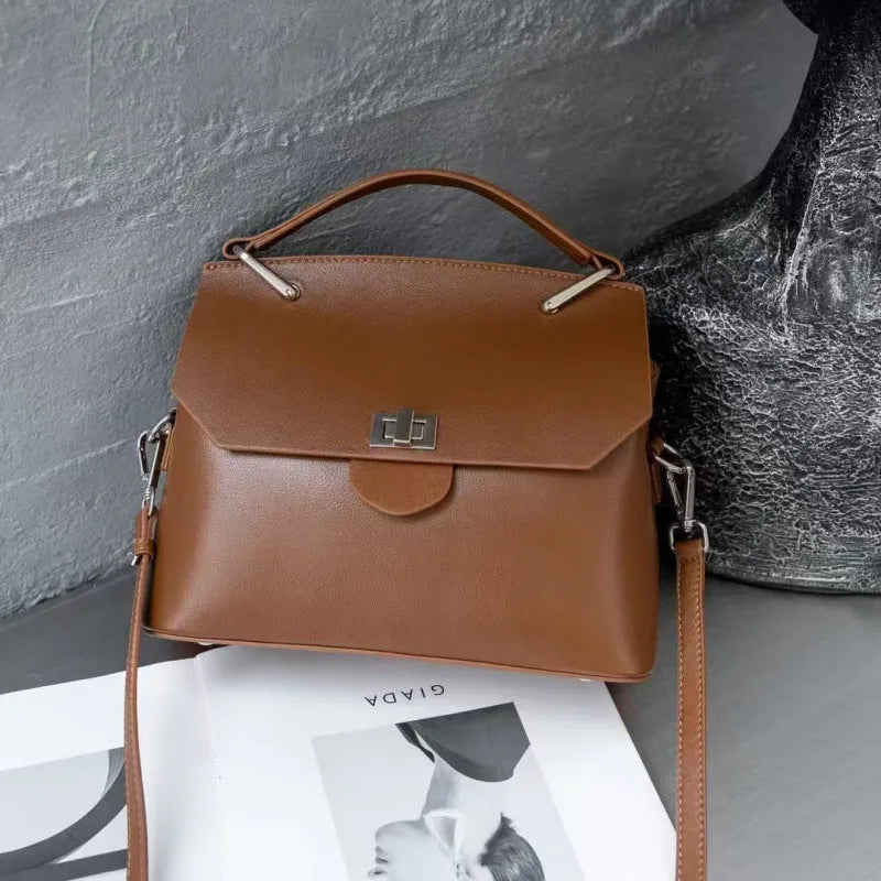 Genuine vegetable-tanned leather messenger bag in urban simplicity style with internal organisation pockets