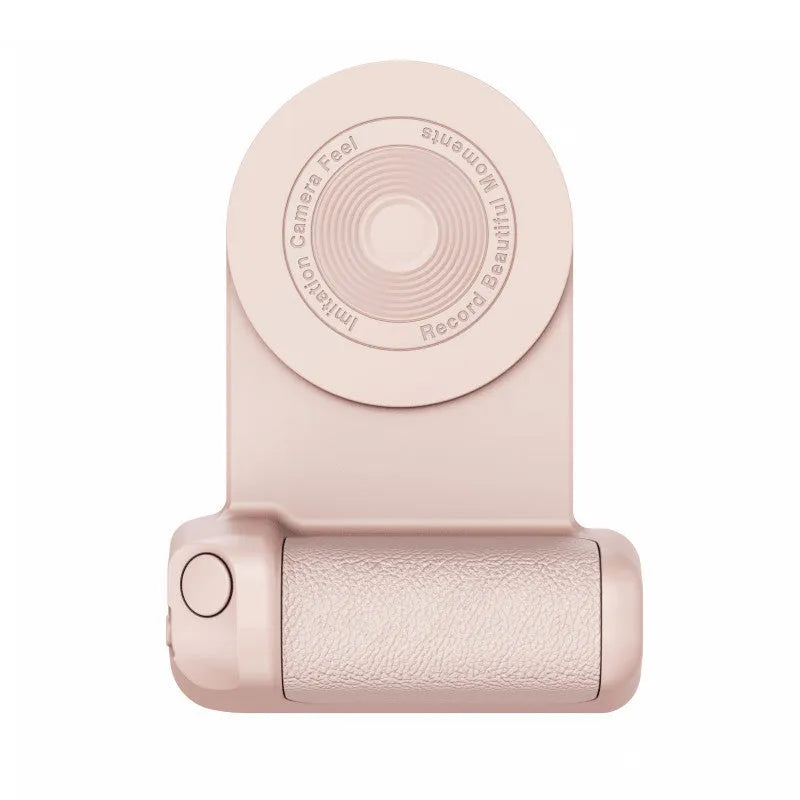 Black magnetic phone camera grip with rotatable bracket and ergonomic PU leather handle on a table.