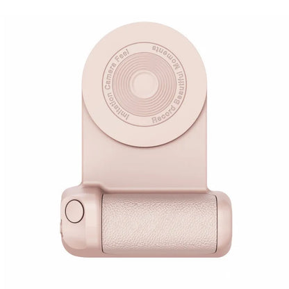 Black magnetic phone camera grip with rotatable bracket and ergonomic PU leather handle on a table.