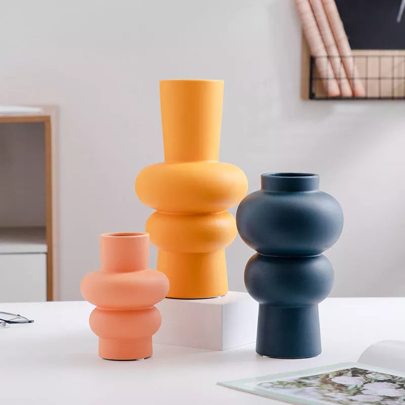 Nordic minimalist ceramic vase with glazed finish in blue, yellow, and orange options