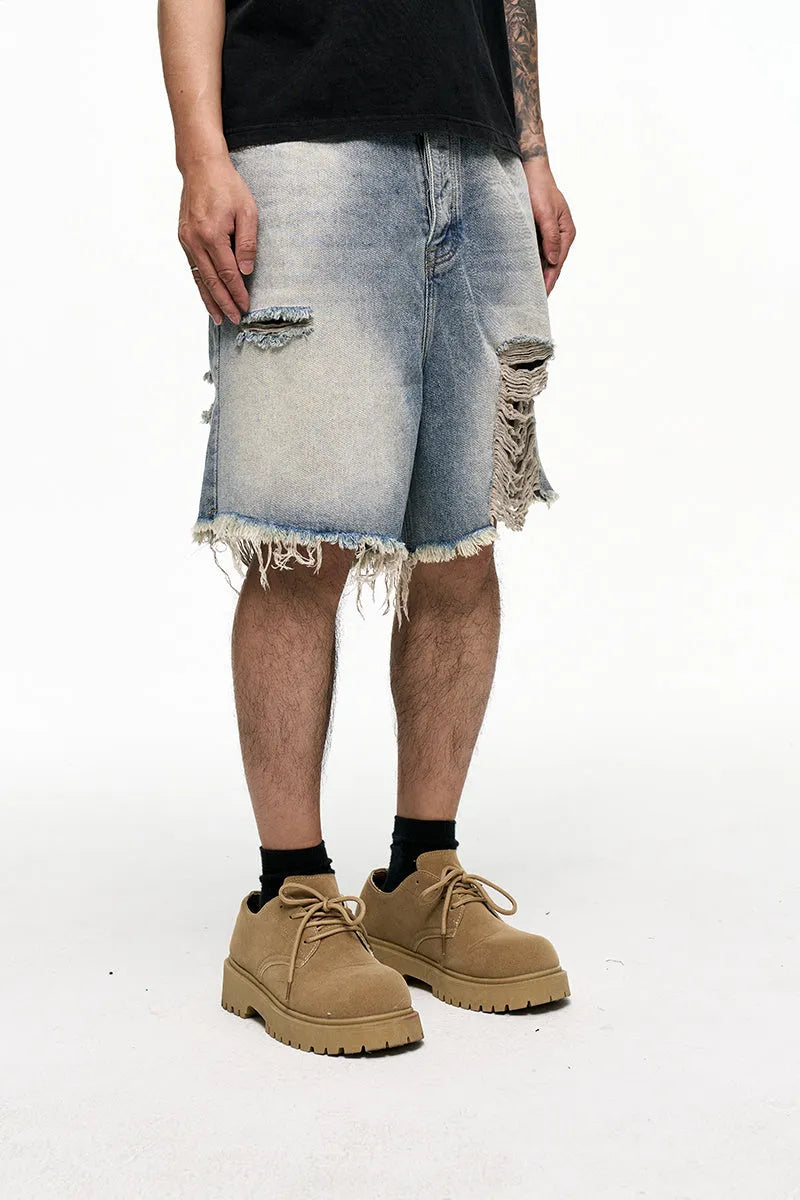 Men's light blue baggy denim shorts with retro washed finish and wide leg cut