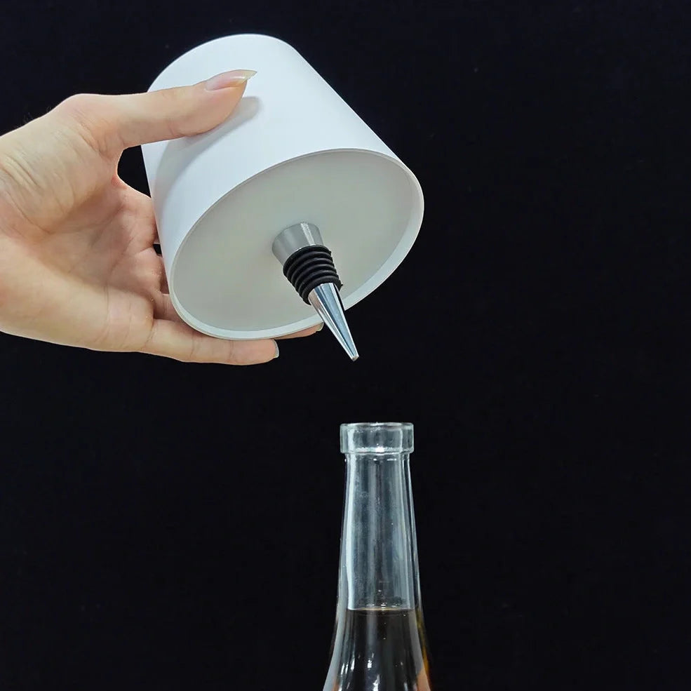 Wireless LED desk lamp in black tricolour finish, bottle-shaped with detachable base and touch control for 2000mAh powered lighting