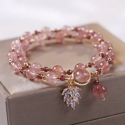 Red Cat's Eye Flower colour double-layer strawberry quartz crystal bracelet with lucky cat charm.