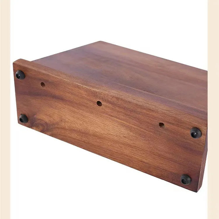 Solid wood magnetic knife holder in wood colour for kitchen storage.