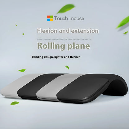 Folding wireless touch mouse showing compact design with Bluetooth connectivity