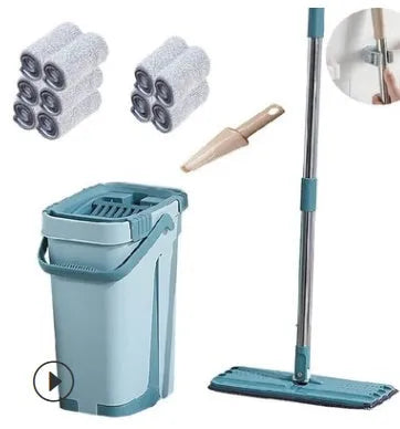 Blue flat floor mop with rotating head and microfiber pad beside plastic bucket for floor cleaning