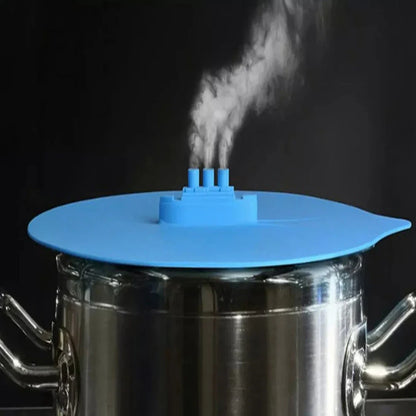 Blue silicone steamer lid on kitchen bowl showing airtight seal and flexible edges