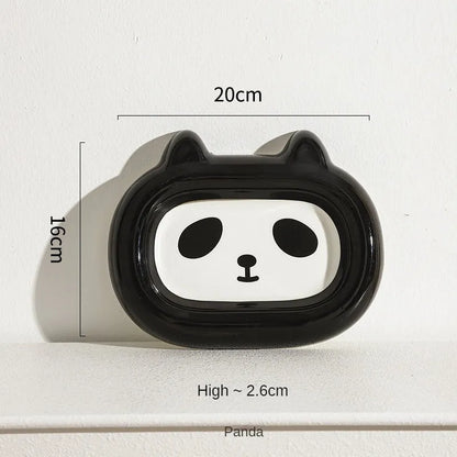 Four ceramic animal-themed pet bowls with frog, panda, pig, and fortune cat designs and silicone non-slip bases