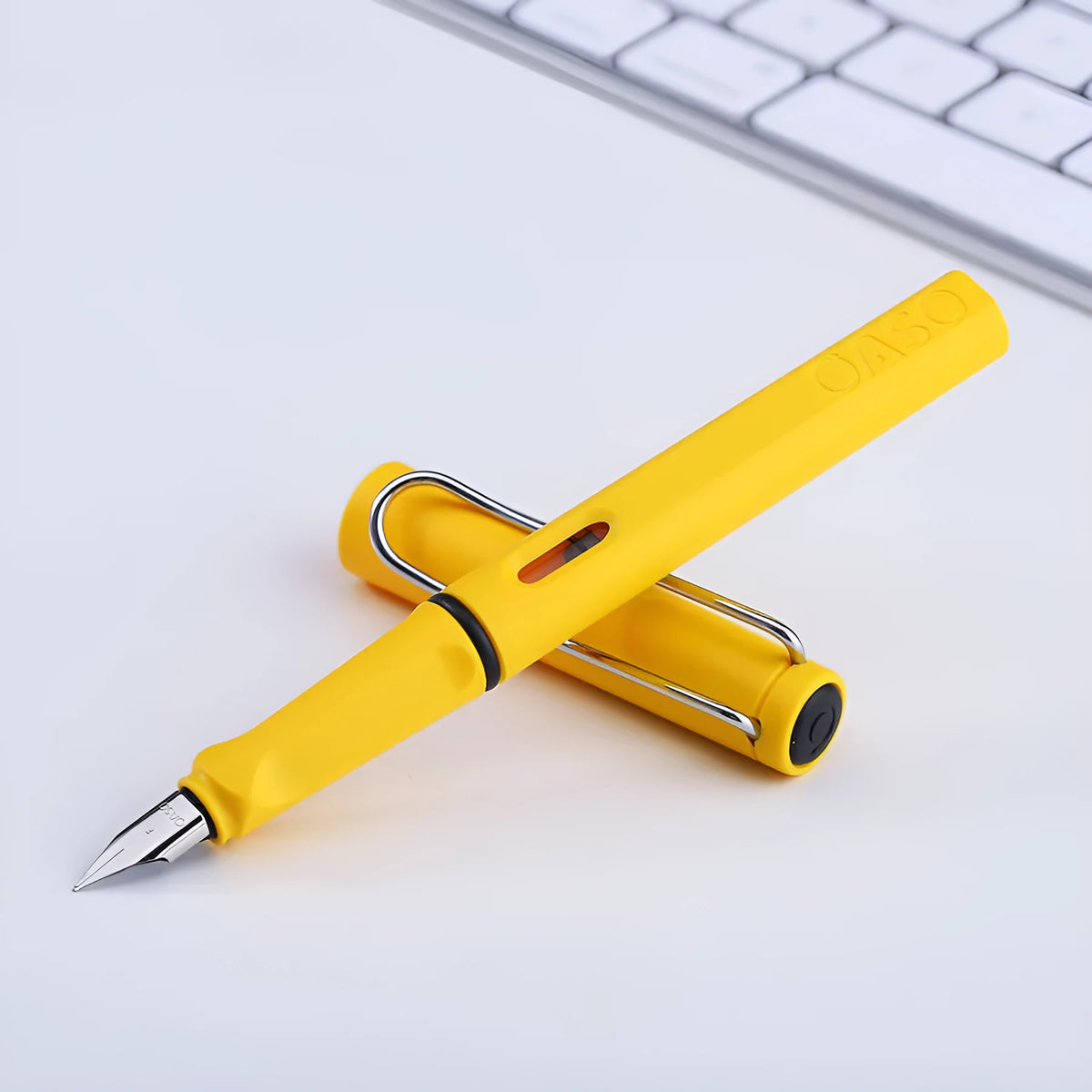 A 0.5mm ink sac pen with a steel nib, plastic shell, and ink bag cartridge visible.