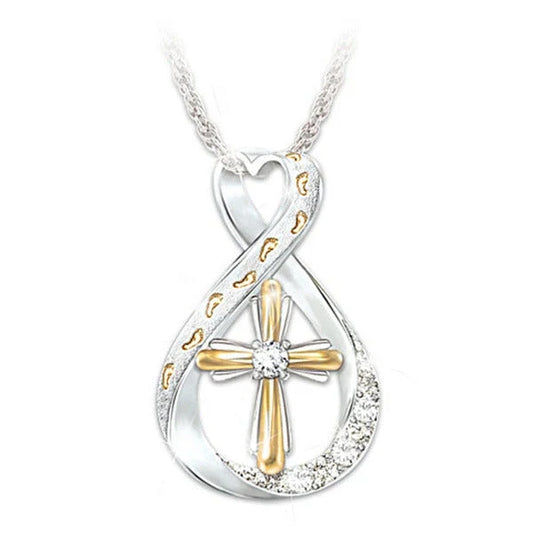 Elegant two-tone cross pendant with sparkling accent, featuring a captivating geometric design and adjustable chain