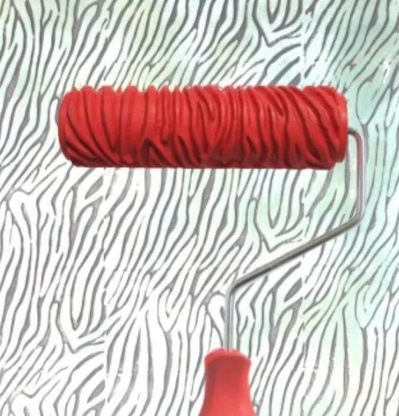 Red 7 inch texture paint embossing roller with patterned rubber head for DIY wall painting.