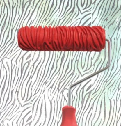 Red 7 inch texture paint embossing roller with patterned rubber head for DIY wall painting.