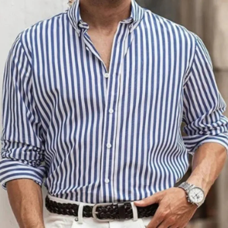 Man modelling a khaki and white striped loose-fit long sleeve casual button shirt.