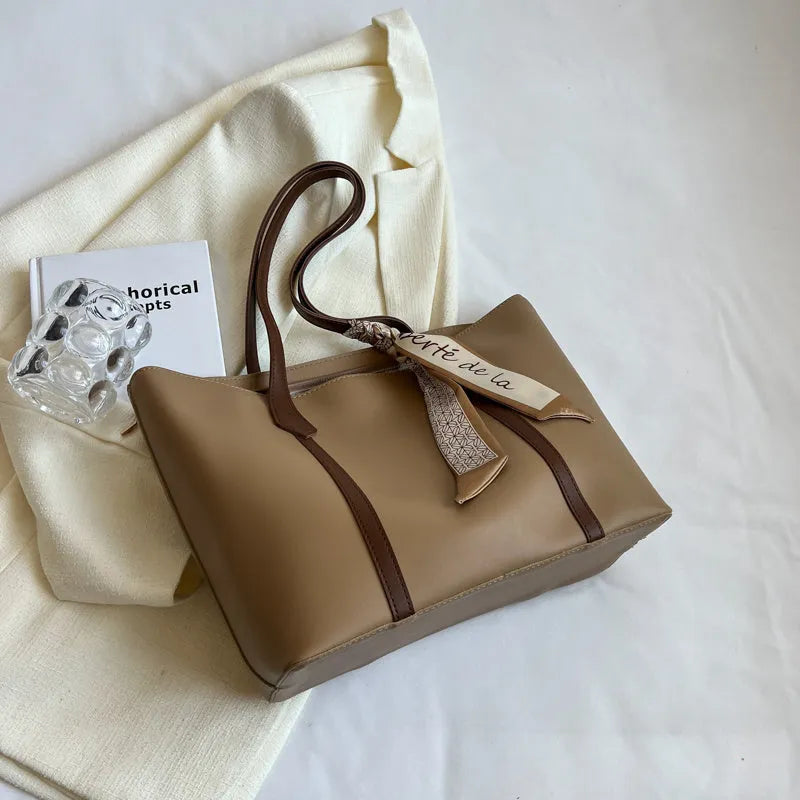 Women's large capacity casual tote crossbody shoulder bag in khaki colour with outer pocket and zip compartment.