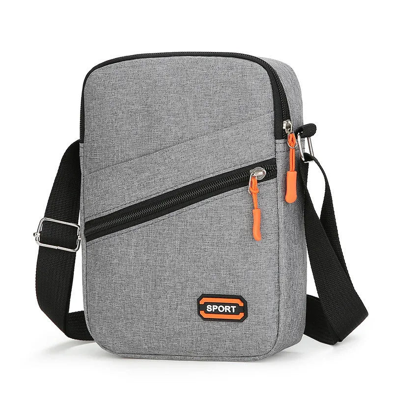 Ultra-light Oxford cloth commuter crossbody bag in solid colour with contrast stitching.
