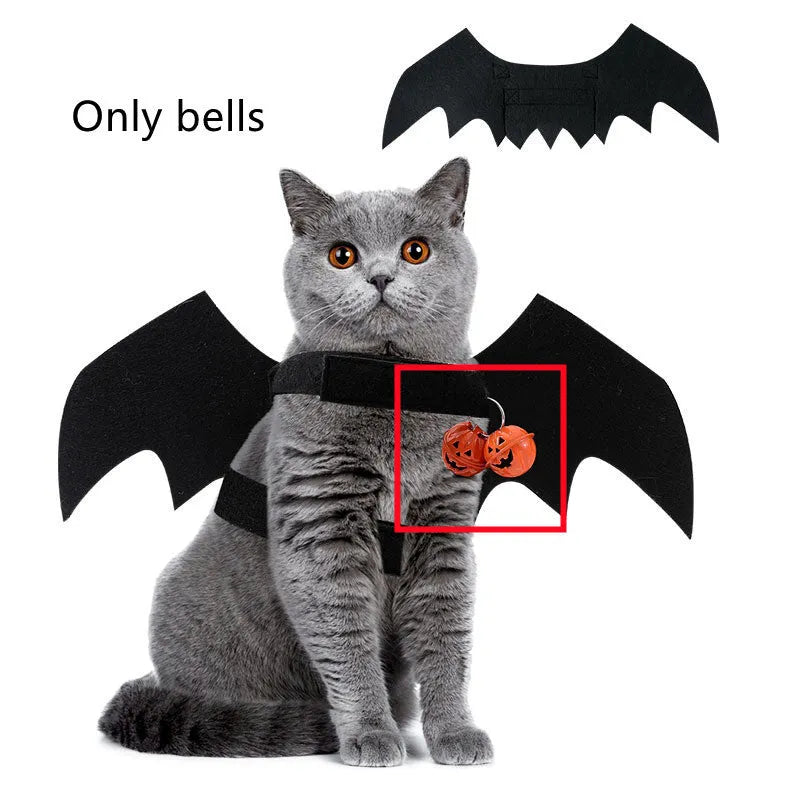 Black felt Halloween pet costume with bat wings and a bell for a dog on a orange background