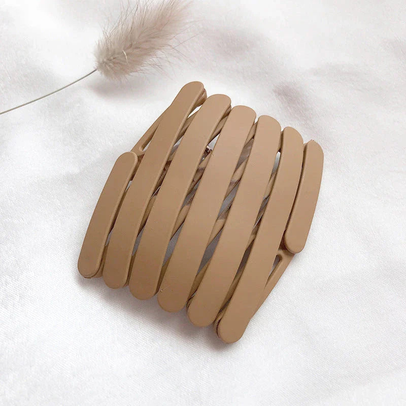 Compact retractable hair band with non-slip teeth grip, available in various colors for versatile styling