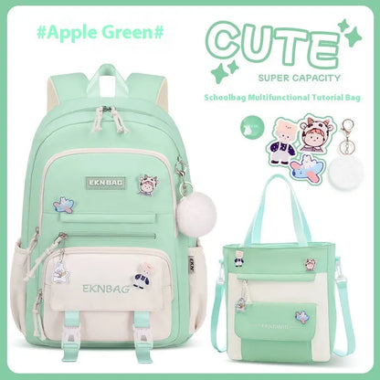 Pink waterproof Oxford cloth school backpack for girls with curved straps on a bookshelf.