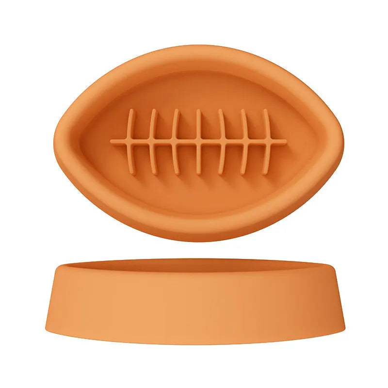 Blue silicone pet slow feeder bowl with textured interior and a white suction cup base on a wooden floor.