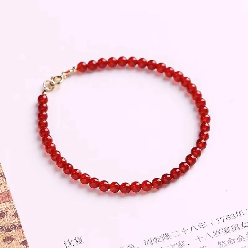Ultra-thin red agate women's bracelet in classic style on wrist