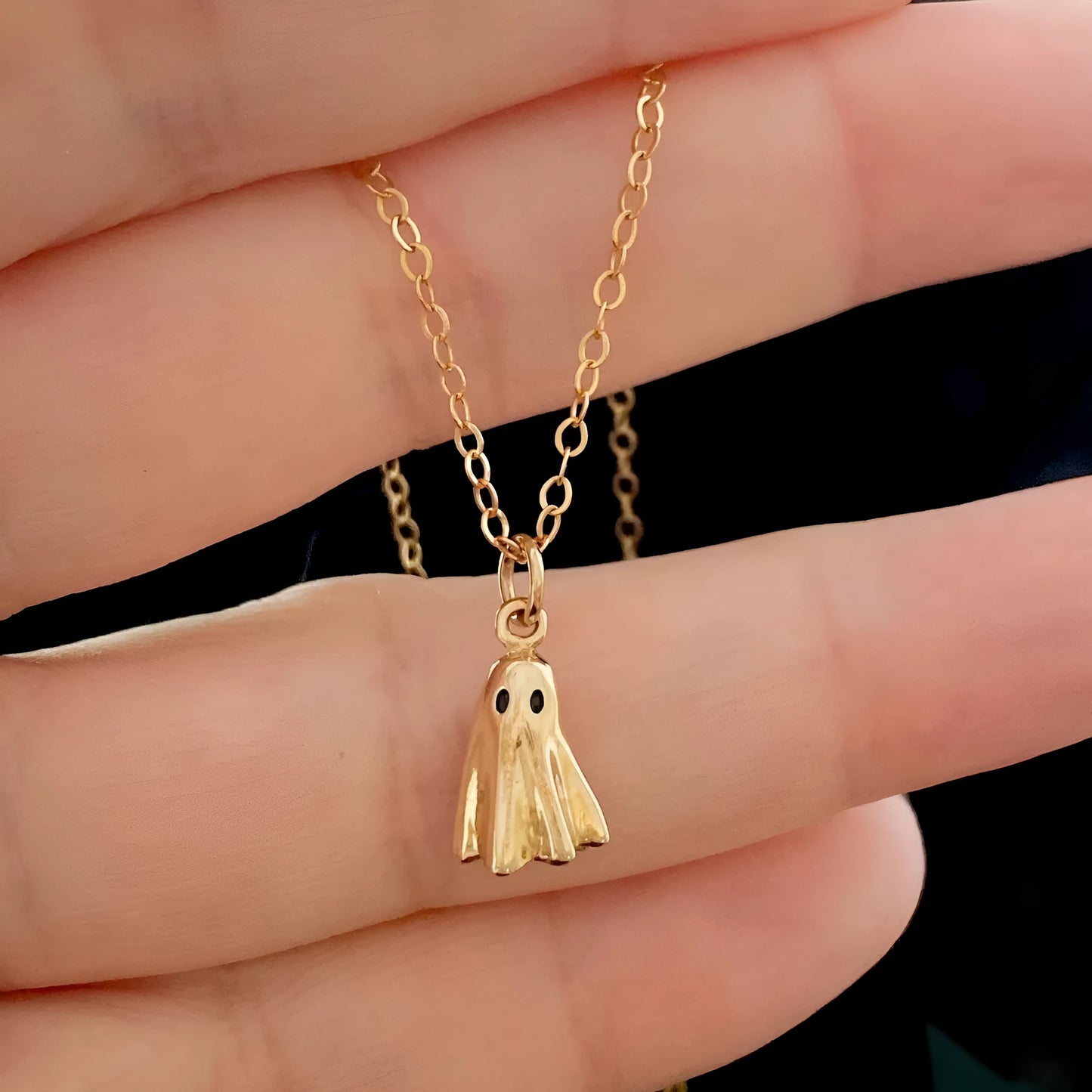 Ghost pendant necklace with titanium steel construction and electroplated finish on twisted chain