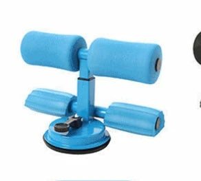 Compact sit-up strength trainer with steel springs and foam padding for home fitness