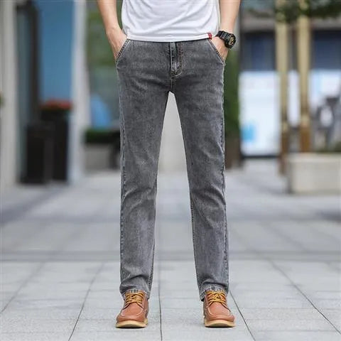 Men's smoky gray straight leg jeans with high elasticity fabric and low waist design