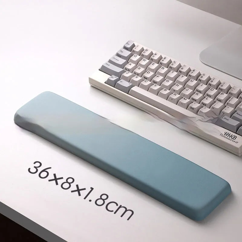 Square cloth-covered silica gel wrist rest mouse pad on a desk.